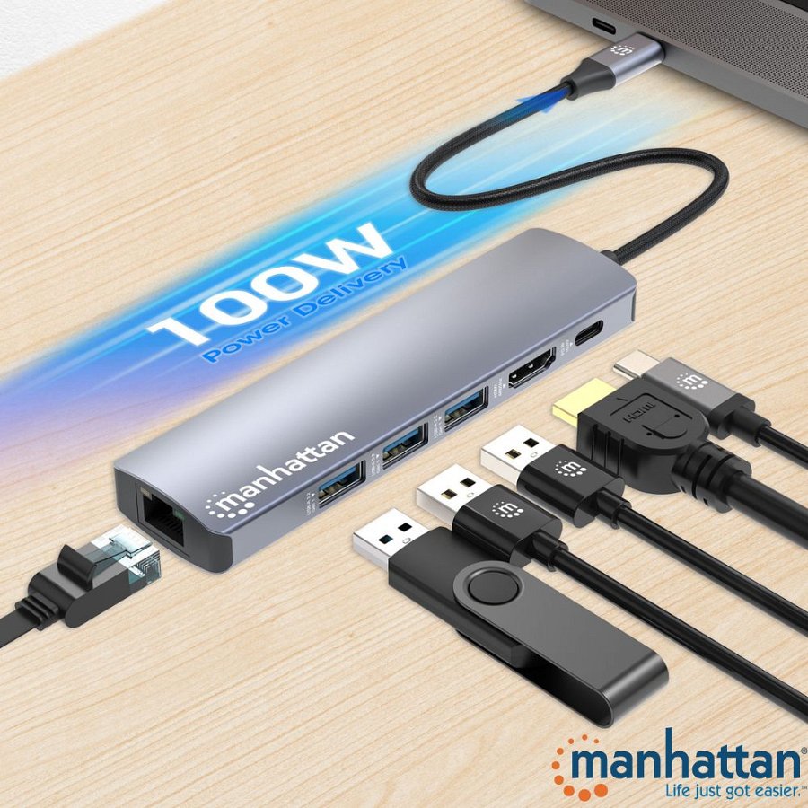 Stacja dokująca USB-C Manattan podpięta do laptopa, do niej podpinane różne kable z logo Manhattan, pendrive i kabel Ethernet. Na górze na niebieskim tle "100 W Power Delivery". 